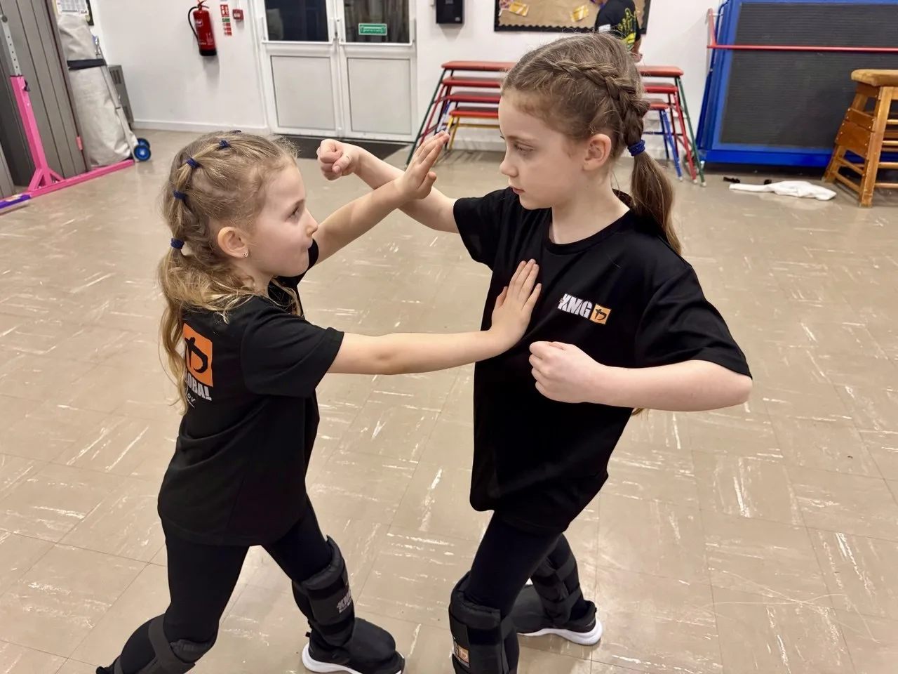 Two girls practising a controlled partner drill